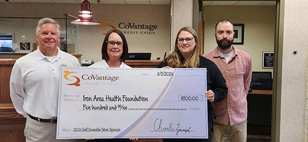 Pictured at the check presentation are, Lyle Smithson Jr. (IAHF Director), Jill Sabotta (IAHF Board Member and tournament coordinator), Kira Dallavalle (CoVantage Credit Union Member Service Representative) and Joseph Parker (CoVantage Credit Union Crystal Falls Branch Manager). Submitted photo.