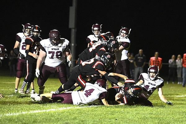 FP junior quarterback Payton Woollard sneaks over the goal line for the winning score in the Trojans’ wild 62-60 double overtime win over Ontonagon on Sept. 11 at Dick Mettlach Field in Crystal Falls. Woollard had a breakout game accounting for 38 points in his team’s win.