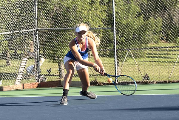 West Iron sophomore No. 3 singles player Brynlee Nodurft scrambles to return a short ball from opponent Lizzy Sliva of Escanaba on Sept. 6 at Nelson Field tennis courts. Nodurft won the match 7-5, 6-2 but the Wykons lost to the Eskymos 5-3.
