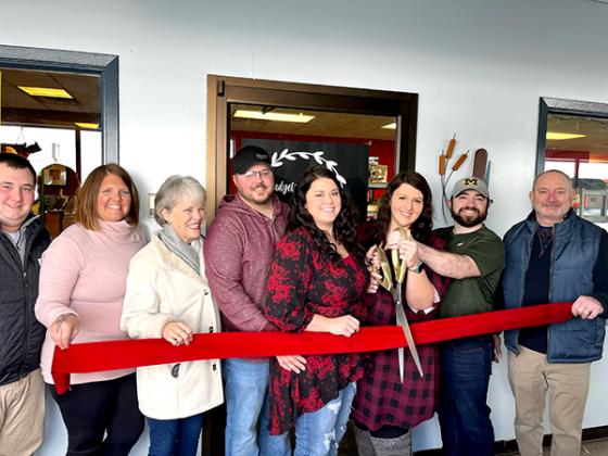 Members of the Iron County Economic Chamber Alliance cut a ribbon for the official opening of Gadgets and Gizmos Galore.  Pictured from left to right: Zach Hautala, Chamber Director, Iron County Economic Chamber Alliance; Katie Clark, President, ICECA; Louisa Kniivila, Office Manager, ICECA; David Oman, Diana Oman, Megan Hatfield, Michael Hatfield (All with Gadgets and Gizmos), Mark Bromley, Managing Director, ICECA.  (submitted photo)