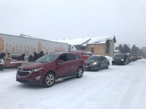 There was a long line of cars ready to receive the “Feed America” food being distributed on Jan. 5 at the Grace Covenant Church in Iron River.