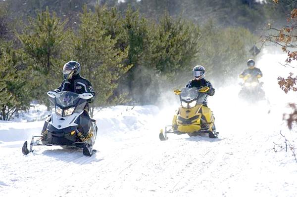 Snowmobiling in Michigan’s UP (Photo Courtesy of Michigan State Parks)