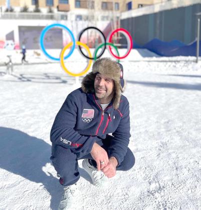 Iron County’s hometown Olympian Nick Baumgartner arrived in Beijing for the 2022 Winter Olympics and posed by the Olympic Rings. (Facebook photo)