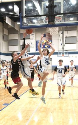 The West Iron Wykons boys basketball team hosted the Forest Park Trojans on Jan. 21 at the Charles Greenlund Gymnasium in Iron River. The final score was Trojans: 59, Wkyons: 39. 