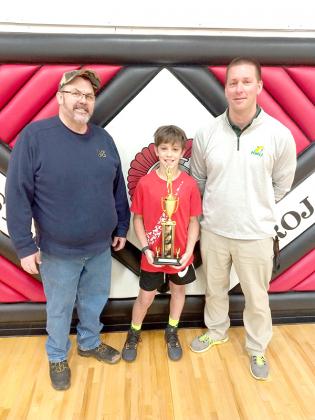 Jace Hagglund (center) recently won the state championship for the 2022 Knights of Columbus free throw contest. Hagglund is a student at Forest Park and won the 11-year-old boys division. Also pictured in the photo are Knights of Columbus members Pat Sommers (left, Grand Knight council 3082) and Kurt Anderson (right, Dean of Students at Forest Park). The Knights of Columbus expressed its gratitude to Forest Park Schools for administering the council level of the competition. (Submitted photo)