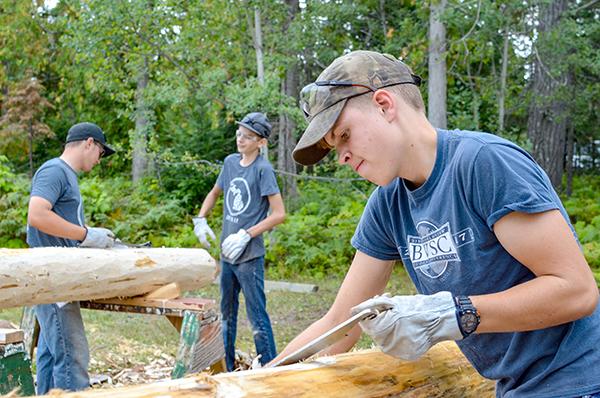 Volunteers from across Michigan help out on a Michigan Cares for Tourism event to complete maintenance tasks at Fort Wilkins Historic State Park in Keweenaw County. (Michigan DNR photo)