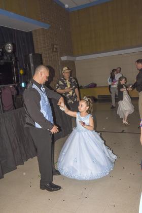 The Stambaugh Elementary PTO hosted the 5th annual Ties and Tiaras Father-Daughter Dance on April 23. Many Fathers, grandfathers, brothers, uncles and significant male-role models showed up ready to dote and dance with their little girls. (Photos by Kevin Zini)