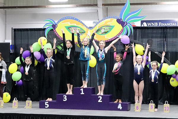 Eden Starr (pictured middle), a 5th grader at Forest Park, competed in the AAU Wisconsin District Girls Gymnastics State Championships in Onalaska, Wis. on Sunday, May 1. She placed 1st on the bars and finished 5th place in her division. This is her first competition season with AAU. (submitted photo)