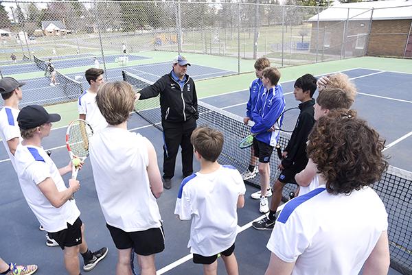 The Wykon team gathers around for instruction from Head Coach, Joe Serbentas before the match against the Menominee Maroons on Monday, May 9. The team lost with a score 0 to 8. 