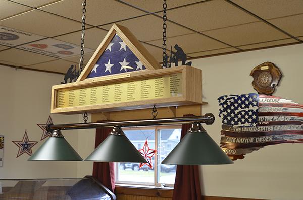 Robert Gallup of Iron River wanted to honor his fellow comrades who fought and died in the Vietnam War by creating two wooden plaques to be displayed at the American Legion Reino Post 21. The plaque above lists the the ninety-nine soldiers from the Upper Peninsula including seven from Iron County.   (submitted photo)
