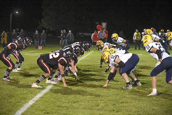 The Forest Park offense lines up against Lake Linden’s defense at the first down line. The Trojans went on to win the game 22 to 14. (all photos by Kevin Zini)