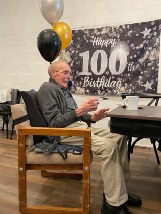 Donald Johnson plays the spoons at his 100th birthday celebration held on Nov. 6.  (submitted photos)