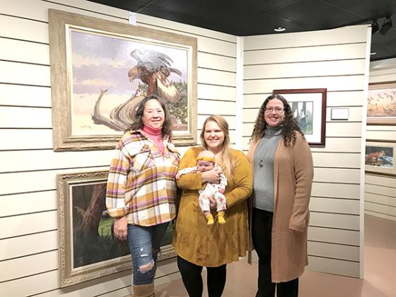 Pictured are, from left, Kathlene (KL) Long who will be appointed the new Museum Dirctor in January 2023, Erika Sauter, Museum Director with baby Sonja and Deborah Davis who will be stepping into a new position of Archives and Exhibits Manager.