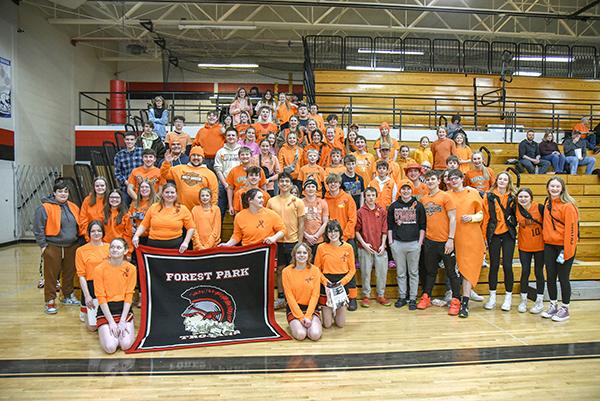 Forest Park was among those to show support for Escanaba and the Weaver family on Jan. 30 at the girls’ basketball game  by wearing orange, the Escanaba school color. Fundraising during the game earned over $1,300 for the Weaver family after an auto accident took the lives of Jerry and Tara Weaver while enroute to their son’s basketball game.  The Weavers left behind three children, two of whom are currently Escanaba High School students. (Kevin Zini photo)