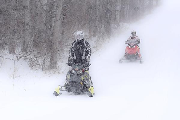 The cold weather didn’t deter snowmobilers on Jan. 27 in the Iron River area. The Iron Range Trail club has two Tucker groomers that keep the 148 miles of trails maintained and safe.  (Kevin Zini photo)