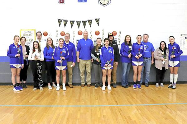 Senior Recognition Night was held on Feb. 21 at the Charles Greenlund Gym during the girls basketball game against the Westwood Patriots. Pictured are, from left, Carli Guzowski, Ashley Polich, Zoe Waters, Daryl Waters, Connie Smith, Autumn Smith, Richard Smith, Coach Eric Shamion, Christina Bett, Taylor Bett, Brandon Olson, Shari Pellizzer, Calli Pellizzer, Dan Pellizzer, Melissa Harty and Kali Harty. (photo by Kathy Holm)