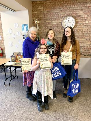 Pictured are, from left, fairytale authors, Patrice Duval – “A Most Valuable Treasure”, Evelyn Mitchell – “A Witch’s Daughter”, Lacey Mattson – “The Boy and the Boulder”  and Abigail Davis – “The Reward”. Other submissions included, Clara Campaign – “Of Fairies, Frogs, and Hats”, Denali Garcia – “The Cave”, Fable Garcia – “Misty the Dragon” and Jezreel Garcia – “The Enchanted Kingdom”.