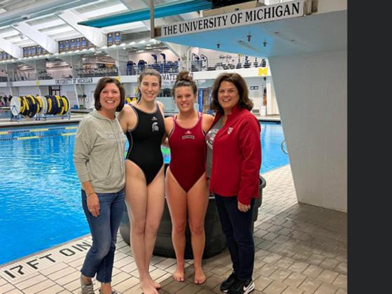 Pictured are, from left, Stacey Marcell Bushey, Emily Bushey, Jenna Caruso and Jill Henchel Caruso. Athletes Past & Present. Emily Bushey swimming for Michigan State and Jenna Caruso Swimming for University of Wisconsin, Madison played against each other.  Both, Emily and Jenna’s moms were West Iron County Graduates and Athletes.  (submitted photo)