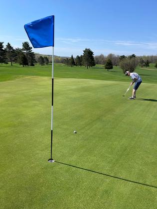 Duane Lombardini was the first men’s golfer of the year on the Iron River Country Club course. Opening day was on Thursday, May 11. (photo by Kevin Zini)