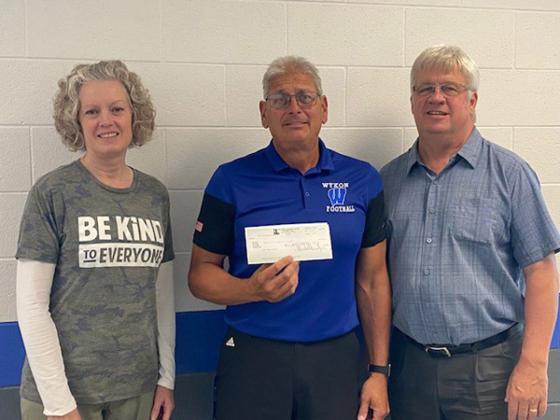 Pictured are, from left, Heidi Priestley, Stambaugh Elementary School Principal; Mike Berutti, West Iron County Middle and High School Principal; Gary Scalcucci, First National Bank & Trust.