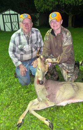 Carson Schmit holding his 8 point buck, with WU mentor, Larry Pifke.