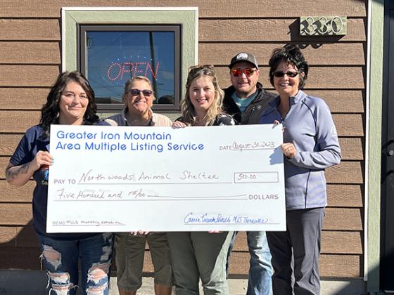 Pictured are, from left, Michelle Clements (Facility Manager Northwoods Animal Shelter), Melanie Sienkiewicz (Re/Max North Country), Nicollette Hanson (Coldwell Banker Real Estate Group), Stephen Remondini (Wild Rivers Realty Inc. & Associtaes) and Punner Franzene (U.P. Riverland Realty Team).