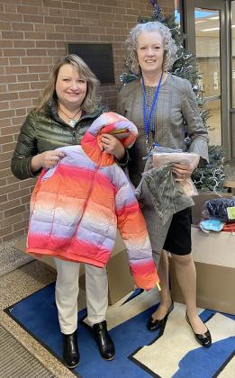 Pictured are, Tina Issacson, Chief Operating Officer at Miner’s State Bank and Heidi Priestley, Principal of Stambaugh Elementary School. Tina with the bountiful donations they made to Stambaugh Elementary School. Boxes full of shirts and pants in all sizes for boys and girls; as well as winter gear of all typeswere donated. We are so thankful for their generosity! Submitted Photo.