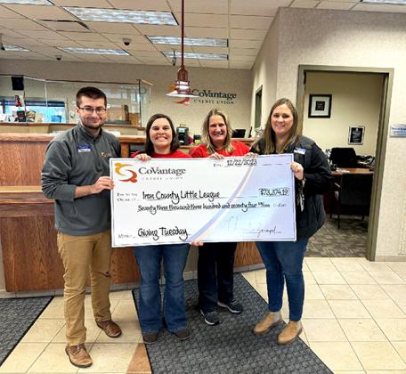 Pictured are, from left, Dawson Rybicki (CoVantage), Alisa Porier and Susan Fritz (Iron County Little League) and Kira Dallavalle (CoVantage), presenting a check for $73,374.19 from the CoVantage Cares Giving Tuesday Fundraiser.