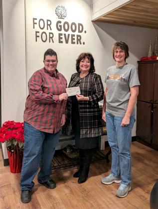 Pictured are,  Rhonda Peterson, Treasurer, accepting the check from Tamara Juul, Executive Director of the Community Foundation, along with Jen Kirk, President of the Tri-County Snowmobile Club.