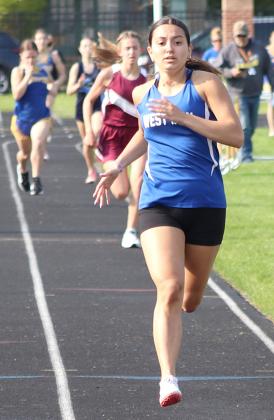 West Iron County Savannah Parker holding her pace in this race.