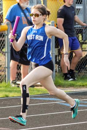 Cheyenne Ritchie of West Iron County determined to give it her all in this relay race.