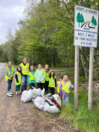 Monday, May 20 the 4-H Young Pacesetters picked up garbage on their two-mile stretch on M-73. Eight bags were filled with all kinds of cans, bottles, plastic, paper, styrofoam and car parts. We encourage everyone to keep their garbage with them until it can be disposed of properly. (Submitted photo.)