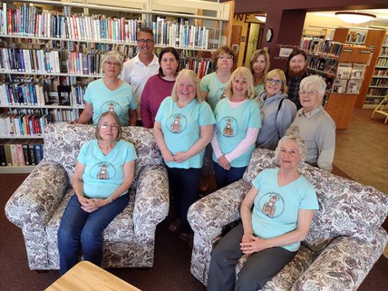 Pictured are, front row,  Joan Kupchynsky and Janet Wagner (Friend’s president); middle row, Mary Ann Keil, Debbie Deuter, Judi Bjork and Ret Ahmisa; back row, Maureen Elson, Nathan Clark, Melissa Taylor, Evelyn Gathu (Library Director), Emily Raffaelli and Gabe Belanger.