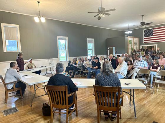 Nearly 100 people crammed into the Bates Township Hall June 3 to voice concerns over the potential sale of a portion of Sunset Lake Park. The board of trustees ultimately rejected the request. 